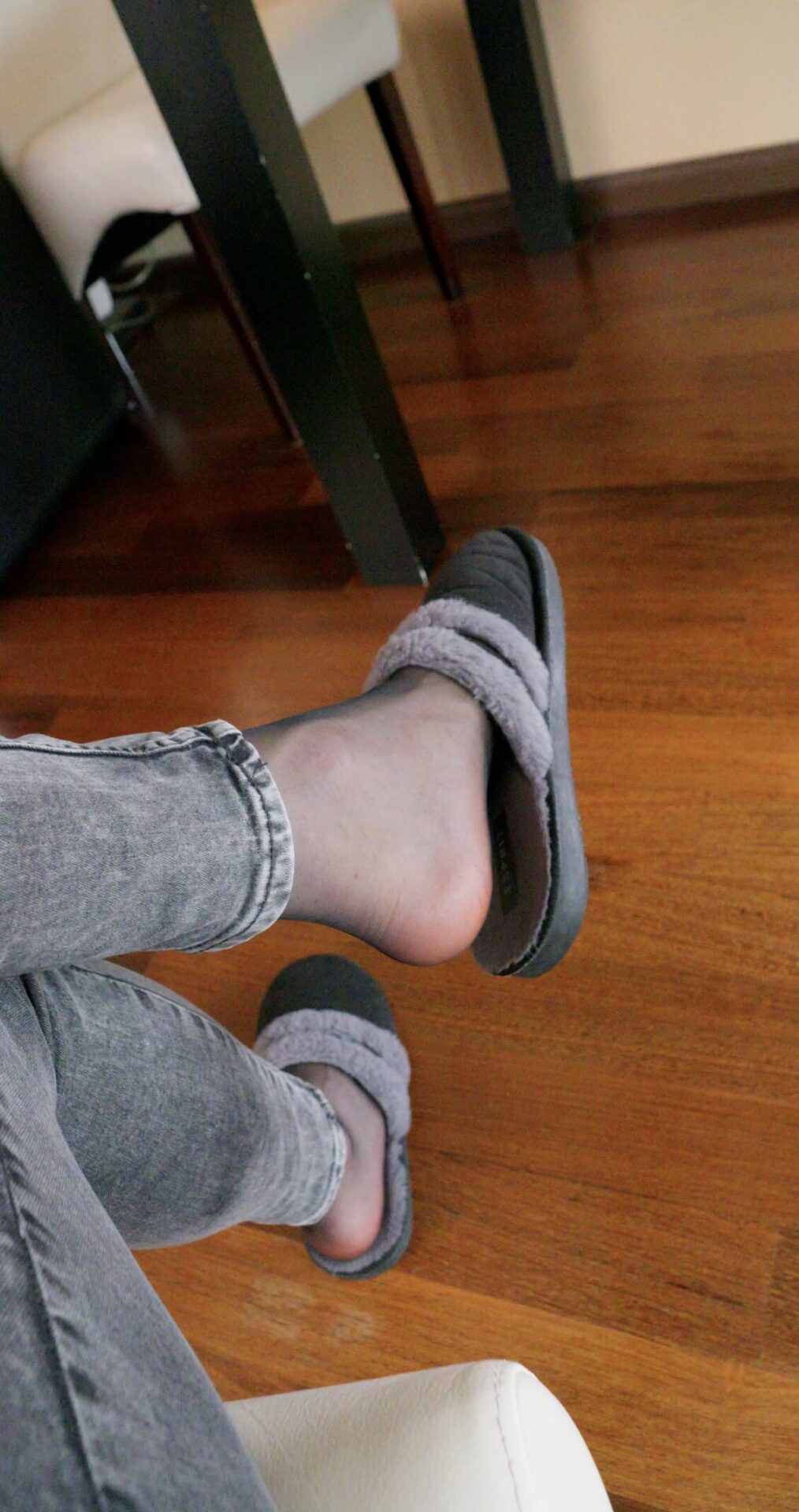 Black pantyhose under jeans and fluffy slipper